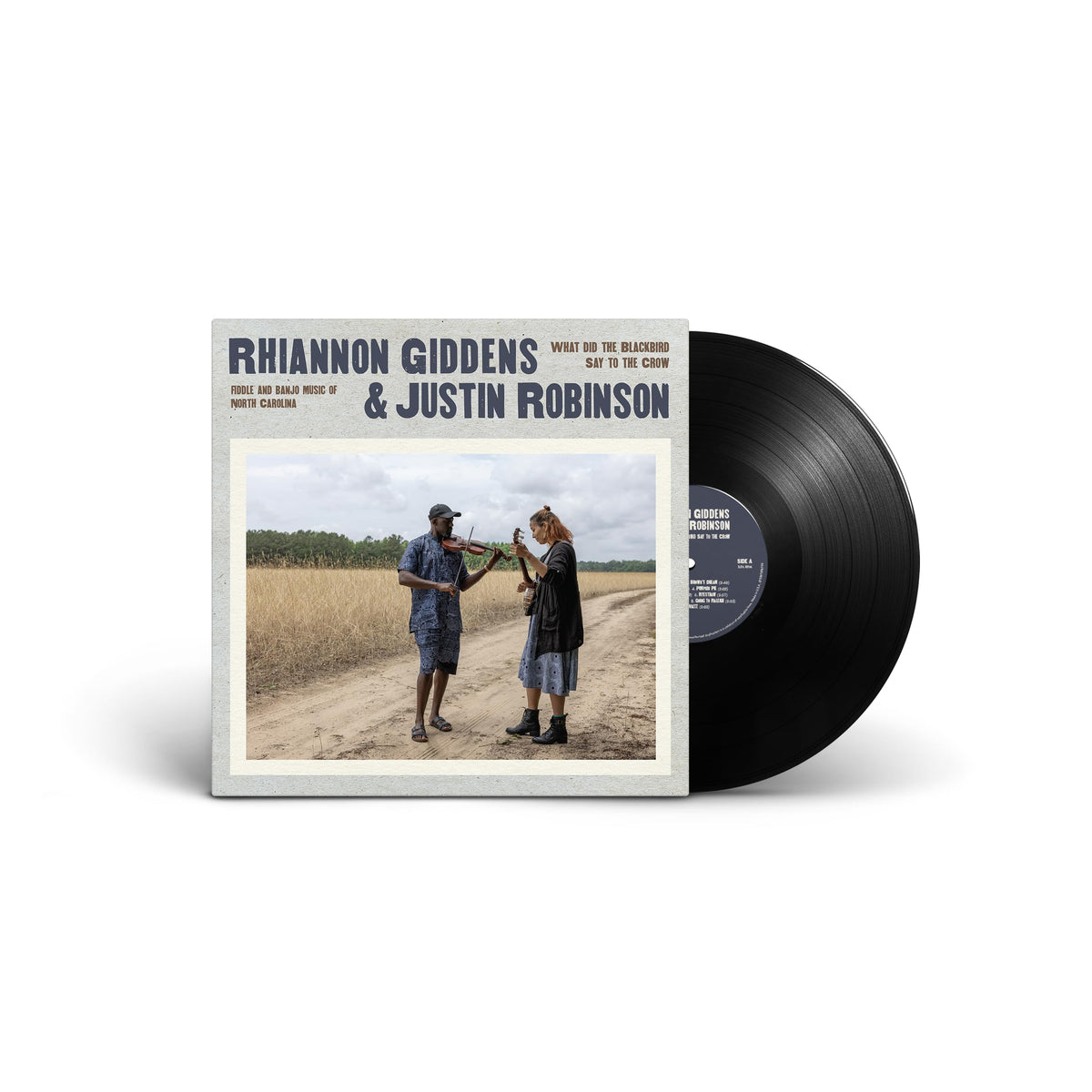Vinyl record with album cover featuring two musicians in a field.