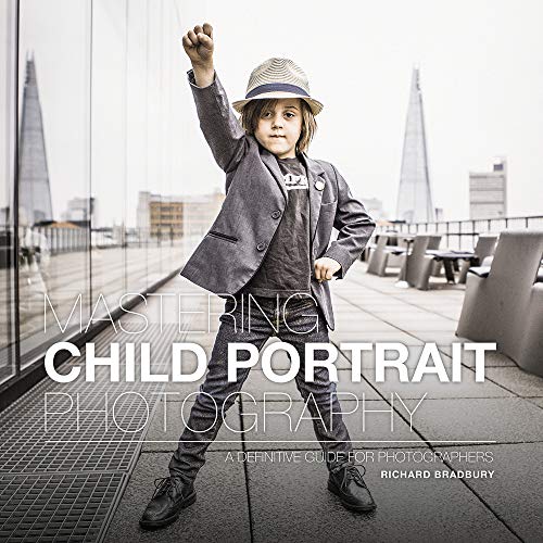 Book cover featuring a young boy in a suit with arms raised.