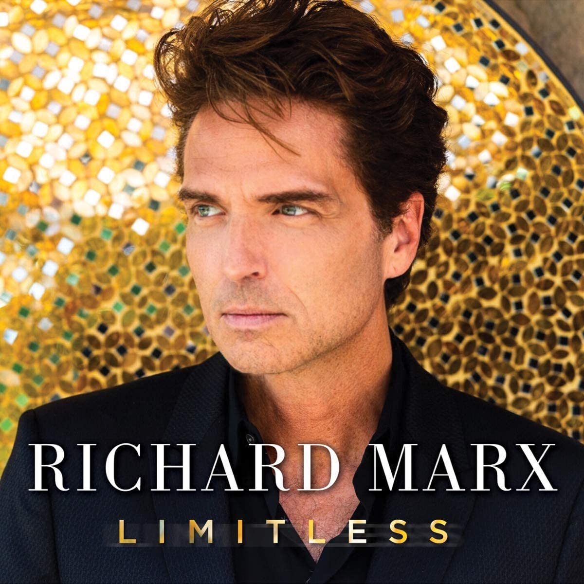 "Album cover featuring Richard Marx with 'LIMITLESS' text, against a gold mosaic background."