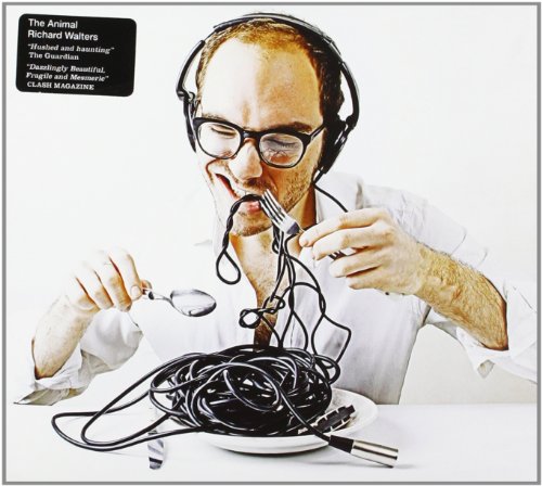 CD cover: Man with headphones eating tangled cords with utensils.