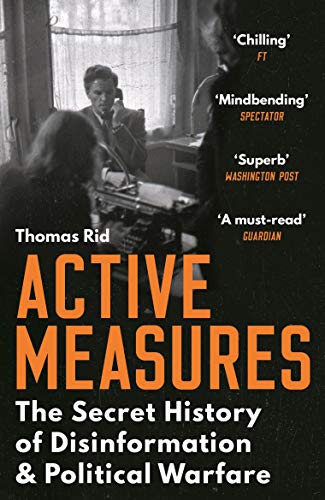 Book cover showing a black and white office scene with large orange text.