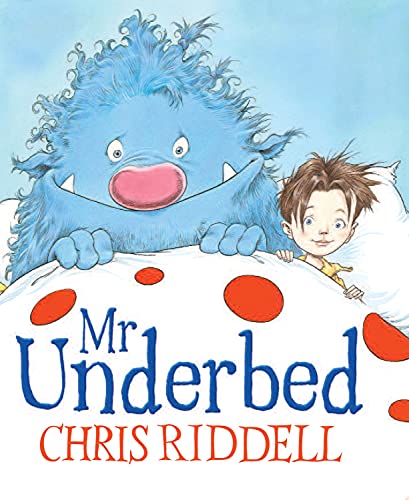 Blue monster and boy peeking from under a white, polka-dotted bed.