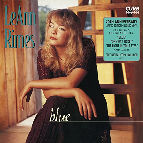 LeAnn Rimes album cover featuring a portrait of the artist in a wooden setting.