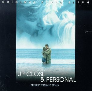 CD cover for “Up Close & Personal” featuring a couple embracing by the sea.