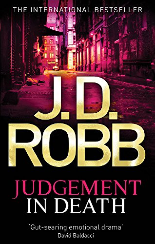 Book cover of Judgement in Death by J.D. Robb featuring a dark city street.