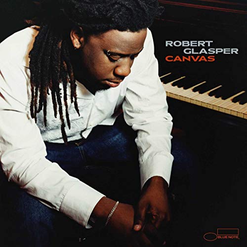 Robert Glasper album cover featuring the artist at a piano.