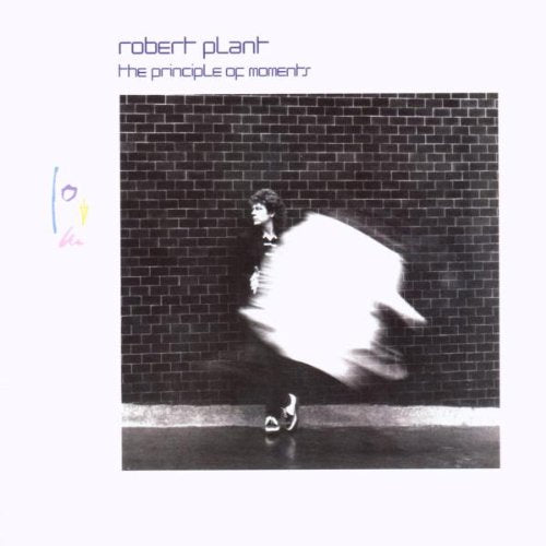 "Album cover with black and white photo of man running past brick wall."