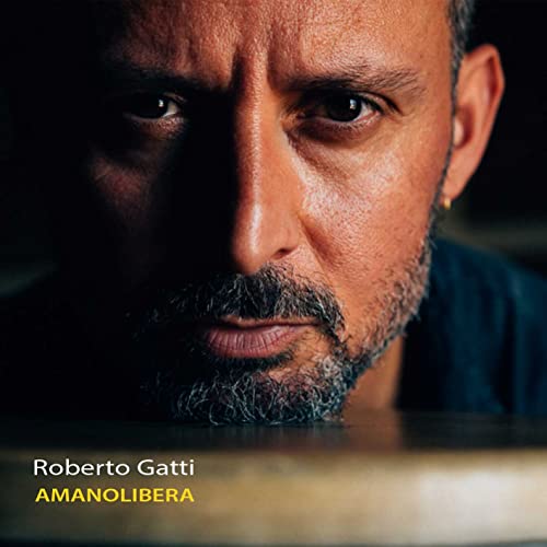 Close-up portrait of Roberto Gatti with album title "Amanolibera" text.