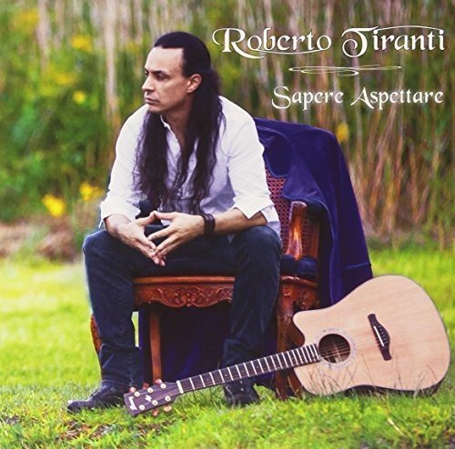 Roberto Tiranti album cover with musician, guitar, and ornate chair.