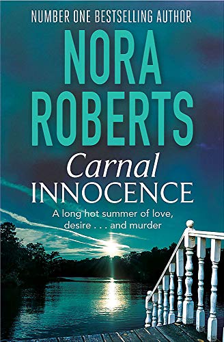 Book cover: "Carnal Innocence" by Nora Roberts, lakeside sunset scene.