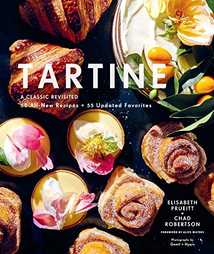 Cookbook “Tartine” cover with pastries, fruit, and floral decorations.