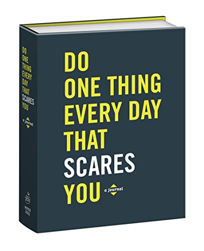 Dark blue journal with yellow text: "Do One Thing Every Day That Scares You.