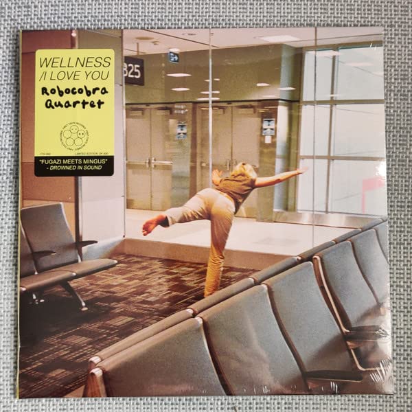 Vinyl album cover for Robocobra Quartet’s “Wellness” with a woman dancing in an airport.