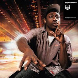 Album cover featuring a man with a blurred city background.