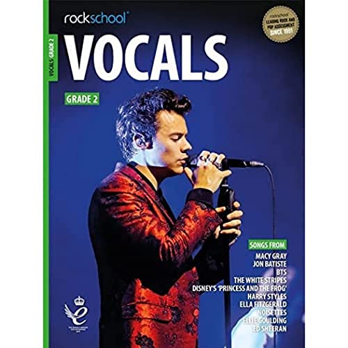 Rockschool Vocals Grade 2 music book cover featuring a singer in a red jacket.