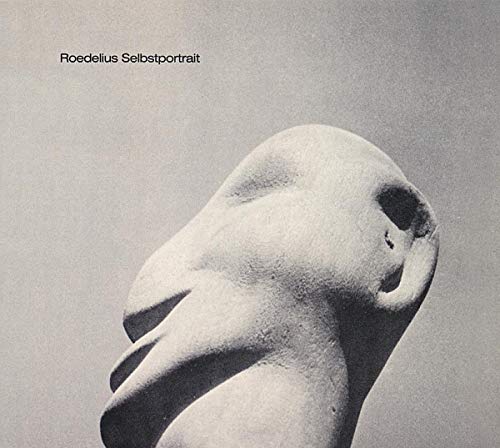 Black and white album cover featuring a sculpted head in profile.