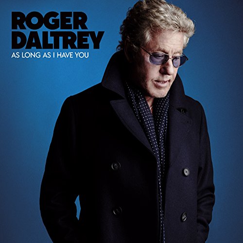 Roger Daltrey wearing a dark coat and sunglasses against a solid blue background.