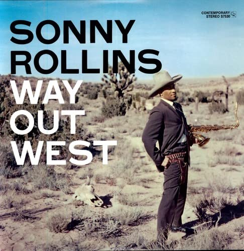 Sonny Rollins album cover: musician with saxophone in desert landscape.