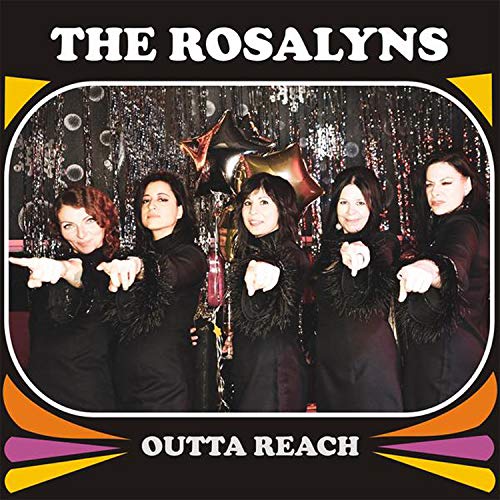 Five women in black point towards viewer, with album title overlay.