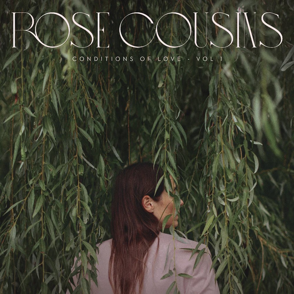 Album cover: woman with long hair framed by weeping willow branches.