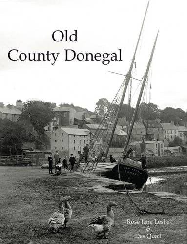 Black and white photo of a sailing ship and coastal town.