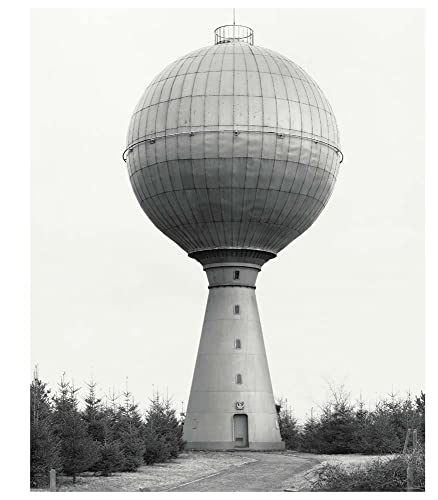 Black and white photograph of a spherical water tower on a conical base.