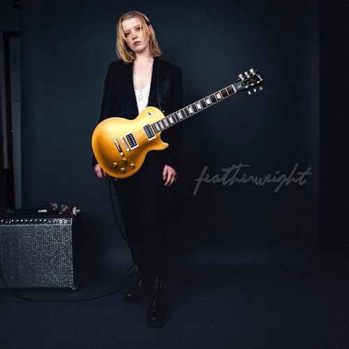 Woman with a gold electric guitar, album cover for "Featherweight.
