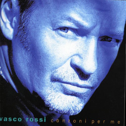 Close-up portrait of Vasco Rossi on a blue "Canzoni Per Me" CD cover.