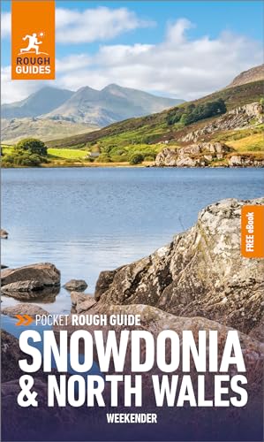 Travel guide cover featuring a lake, mountains, and rocky foreground.