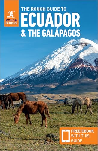 Travel guide cover featuring a snow-capped mountain and grazing horses.