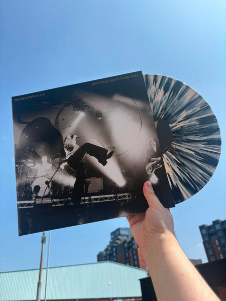 Vinyl record of The Royston Club live album, held in a hand.