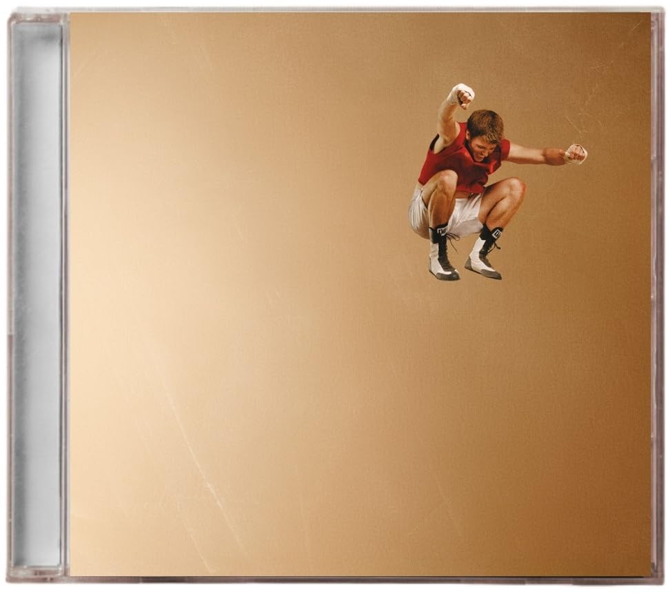 CD case featuring a young man in red and white mid-jump.