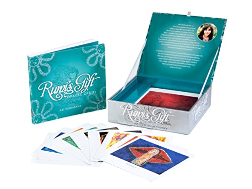 Teal box of "Rumi's Gift" oracle cards with colorful illustrated cards displayed.
