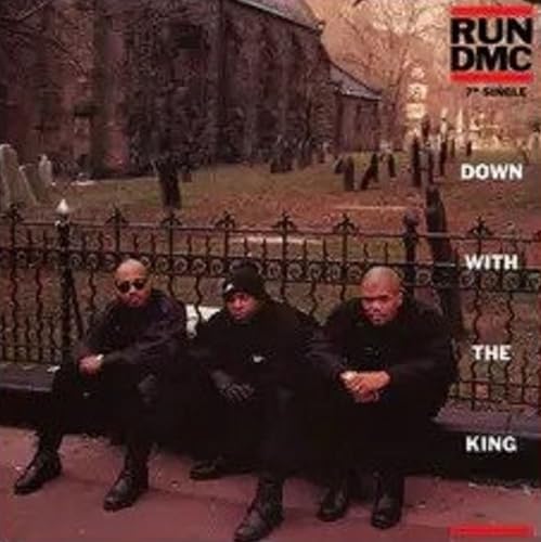 Run-DMC members sitting in front of a graveyard fence on the album cover.