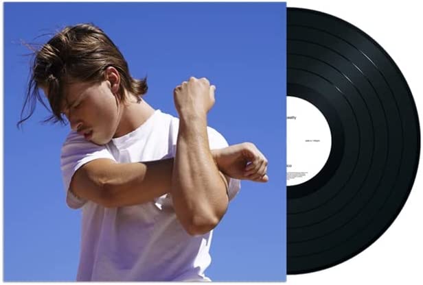 Vinyl record and cover art featuring a man in a white t-shirt.