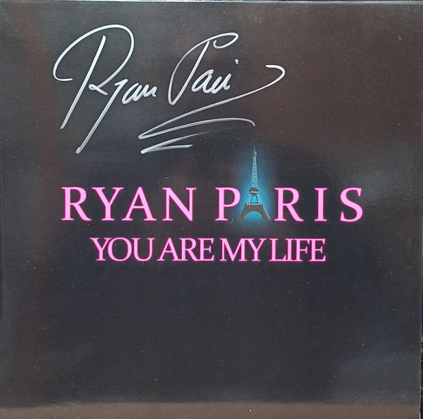 Ryan Paris record cover with signature, Eiffel Tower, and pink text.