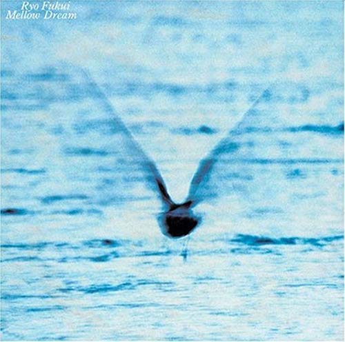 Blue-toned album cover with a blurred image of a bird in flight.