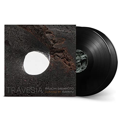 Ryuichi Sakamoto's "Travesía" vinyl record with textured dark cover art.