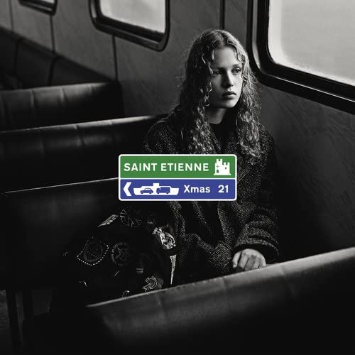 Black and white album cover featuring a woman on public transport.
