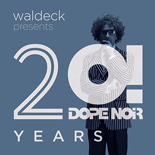 Album cover featuring a man in a striped suit with large numbers "20" and text.
