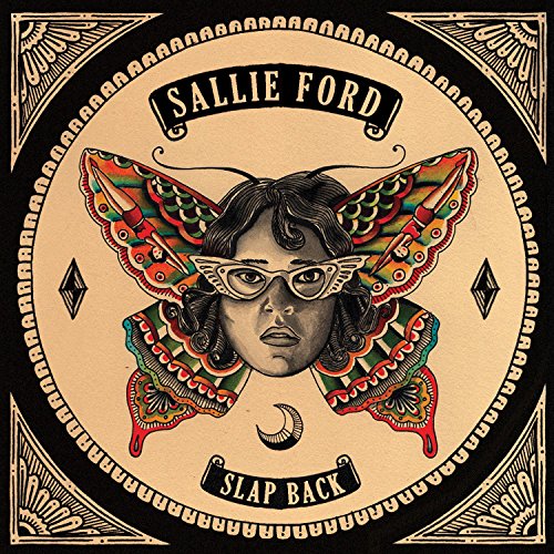CD cover: woman’s face with butterfly wings in ornate frame.