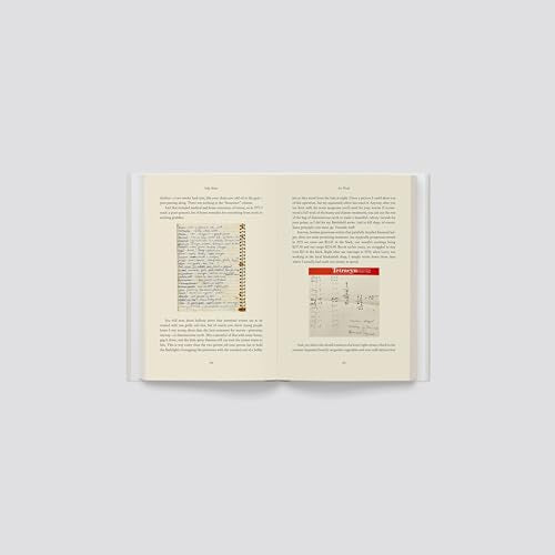 Open book with dense text and a small, faded image on right page.
