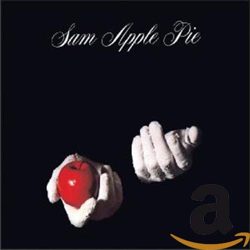 White gloved hands holding a red apple against a black background.