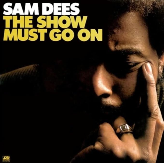 Album cover for Sam Dees’ “The Show Must Go On” featuring a portrait.