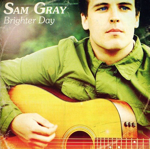 CD cover for Sam Gray’s “Brighter Day” featuring a man with a guitar.