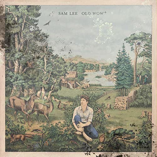 CD cover: man seated in a lush, detailed forest landscape.