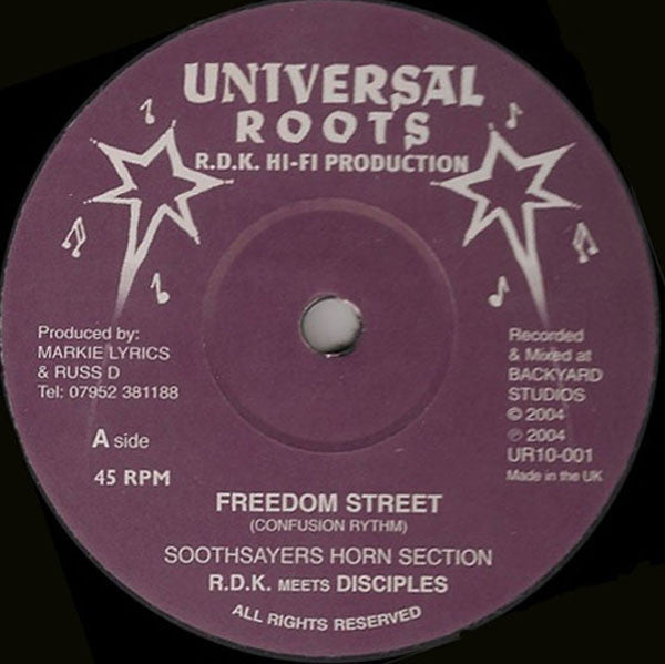 Purple vinyl record label with white text, star graphics, and central spindle hole.