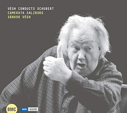 Black and white portrait of conductor Sándor Végh with a thumbs-up.