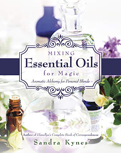 Book cover with essential oil bottles, flowers, and title "Mixing Essential Oils for Magic".