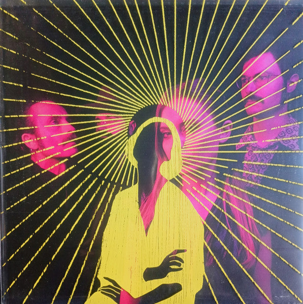 Vinyl album cover with radiating yellow lines and pink, blurred figures.